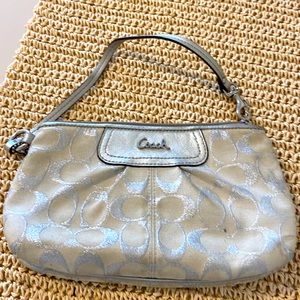 SOLD! Coach wristlet. Large size. White and silver. Good condition.